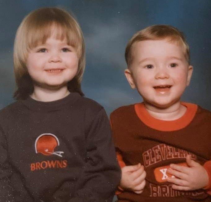 Baby photo of Julie and her brother in Cleveland Browns clothes